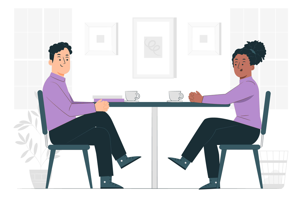 Man and woman discussing over a cup of tea